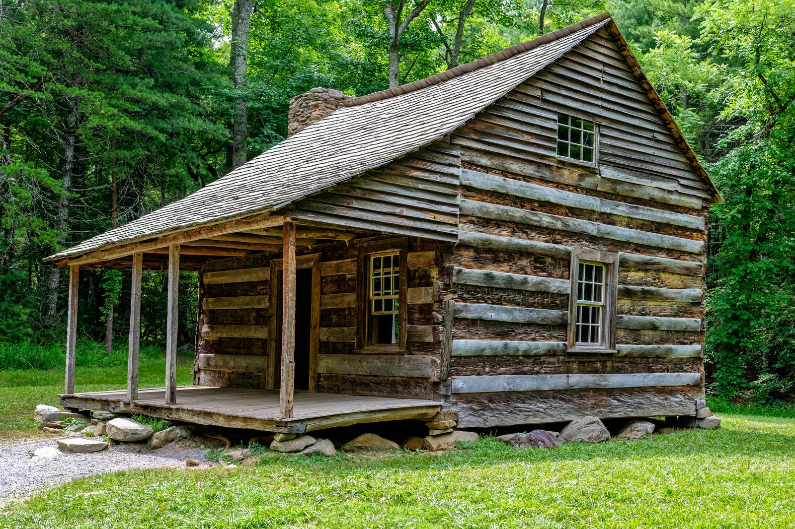 Historic log cabins and mountain valleys of Cades Cove where search headquarters were established in 1969
